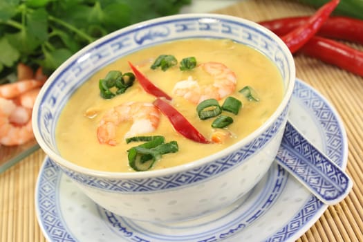 Curry soup with colourful vegetables and prawns