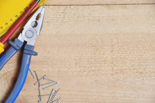 complete of tools on a wooden background