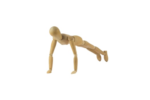 Wooden female figure is doing pushups