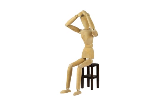 A wooden female doll in desperation