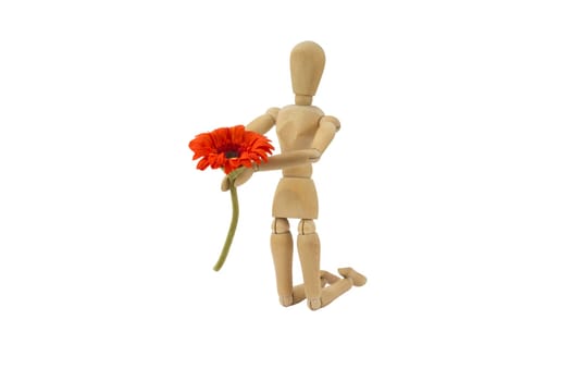 A wooden female doll is making a proposal