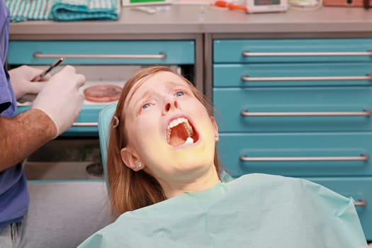 Blonde girl scared to death of the dentist