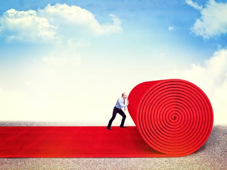 man roll huge red carpet