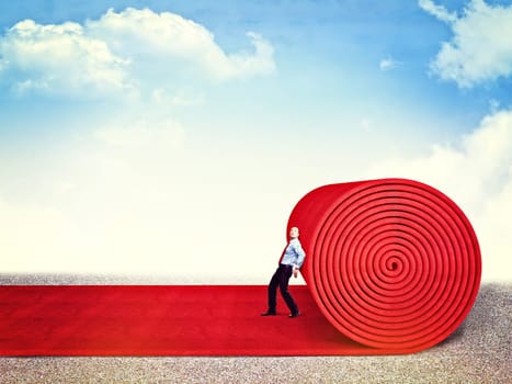 man roll huge red carpet