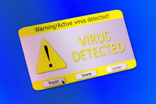 Virus alert message on the blue computer screen