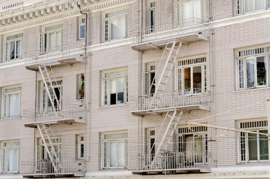 facade of a building with fire escapes in San Francisco
