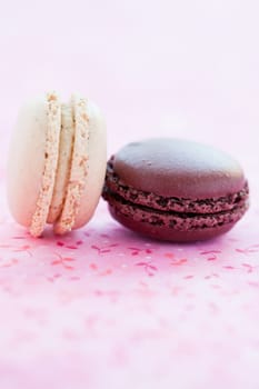 Closeup of two sweet macaroons on pink mat