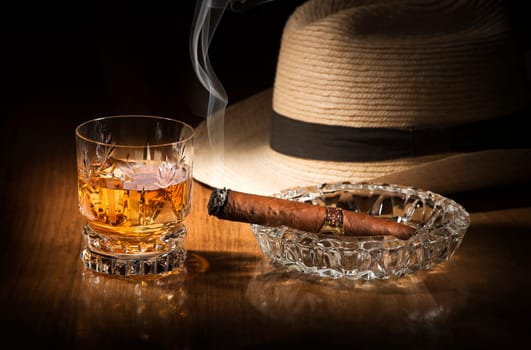 Cuban style rum and cigar close up