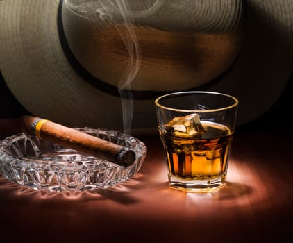 Cuban style rum and cigar close up