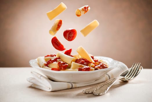 Macaroni pasta with tomato sauce close up