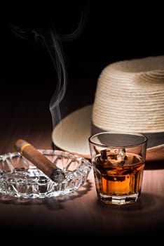 Cuban style rum and cigar close up