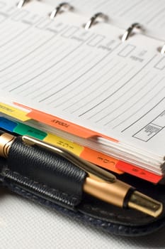 note book with pencil close up shoot