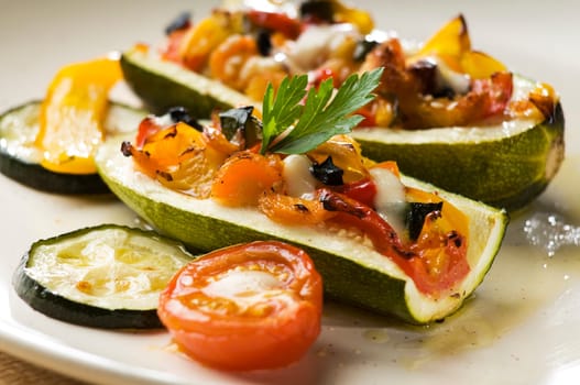 Baked pumpkin stuffed with vegetables and mozzarella cheese close up