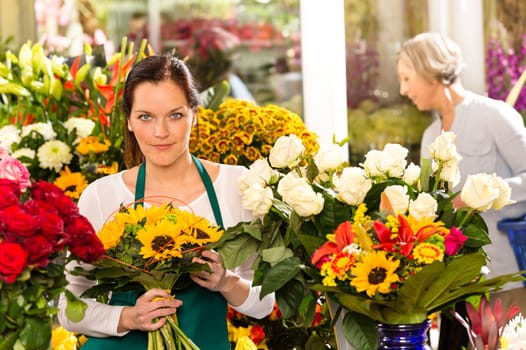 Woman florist selling sunflowers bouquet flower shop market buying