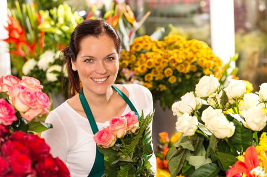 Smiling florist flower shop colorful making bouquet roses market