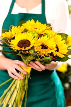 Woman holding bouquet sunflowers florist yellow flower shop