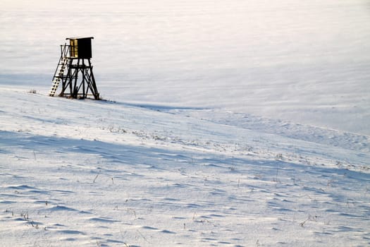 Winter landscape with high seat