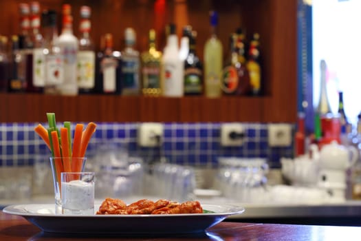 Buffalo chicken served in pub desk
