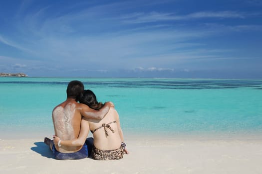happy young asian couple enjoying summer and have on beautiful white sand beach