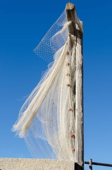 fishing nets in the wind under the sky of Camogli Genoa