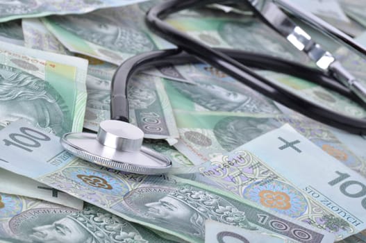stethoscope and polish banknotes in background