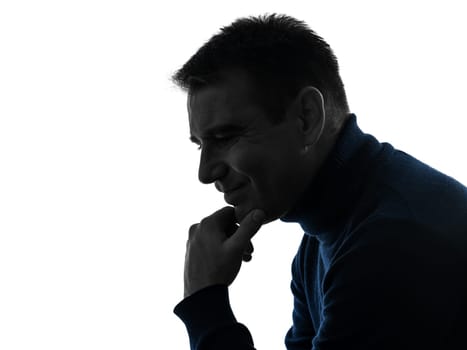 one cacsasian man serious thinking pensive portrait in silhouette studio isolated on white background