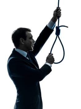 one caucasian man  holding adjusting  hangmans noose in silhouette studio isolated on white background
