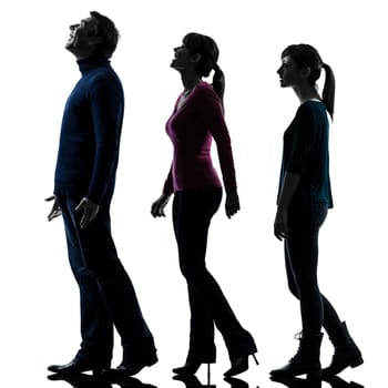 one caucasian family father mother daughter man looking up surprised happy in silhouette studio isolated on white background