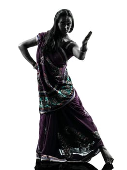 one indian woman dancer dancing in silhouette studio isolated on white background