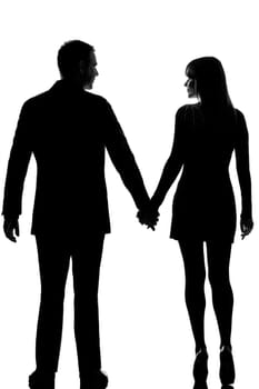 rear view one lovers caucasian couple man and woman walking hand in hand in studio silhouette isolated on white background