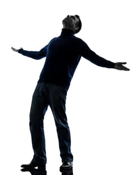 one caucasian happy man looking up full length in silhouette studio isolated on white background
