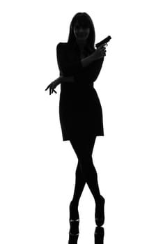 one caucasian sexy detective  woman holding aiming  gun in silhouette studio isolated on white background