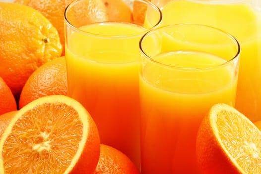 Composition with two glasses of orange juice and fruits