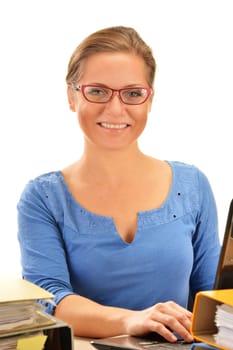 Young woman at office desk isolated on white background