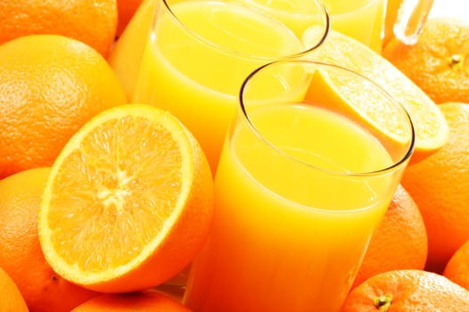 Composition with two glasses of orange juice and fruits