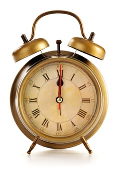 Old alarm clock isolated on white background