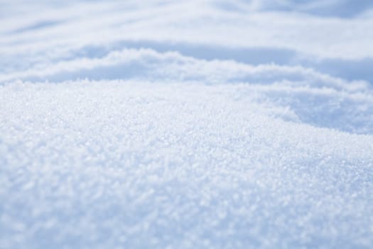 Fresh white powder snow background from outdoors on winter day