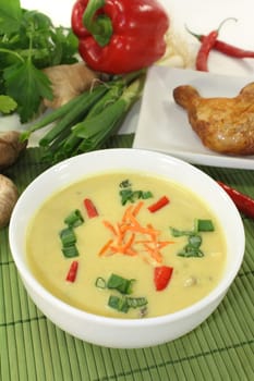 Curry soup with colorful vegetables and chicken