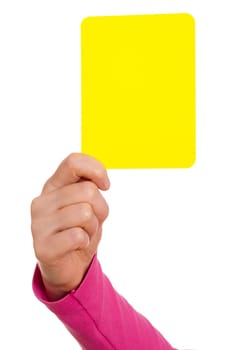 Female hand showing a yellow card