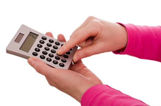 Two female hands typing on a calculator
