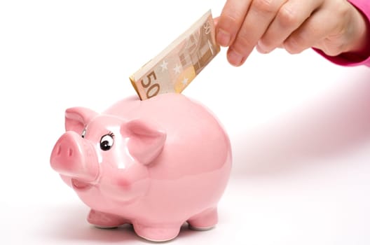 Pink piggy bank with 50 euro bill