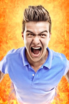 Young terrified man crying in fire. Concept for judgment day.