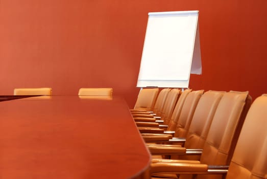 Long table for meetings with the chairs around the perimeter