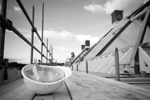 empty building site with left helmet on scaffold. Concept crisis building industry