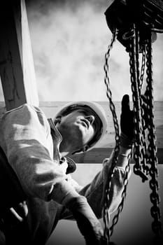 carpenter at work with wooden  roof construction