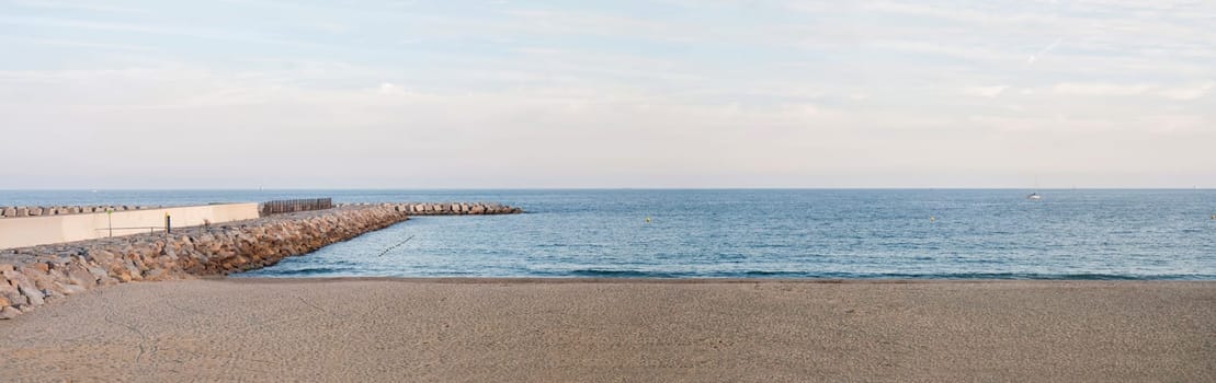 Panoramic sea landscape with beach and pier