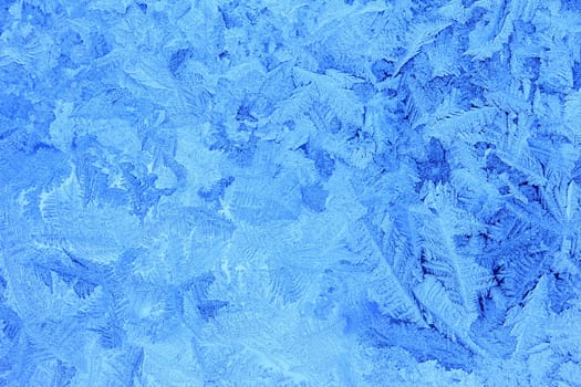 Ice flowers on an icy window pane