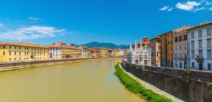 View of the medieval town of Pisa and river Arno in Italy