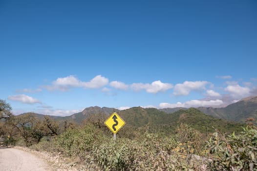 Curvy signpost on the Los Lagos trails in the Potrero de Yala Provincial Park in Jujuy, Argentina.