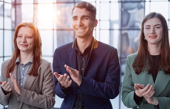 Shot of a group of businesspeople applauding during a seminar in the conference room.